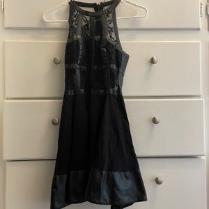 Black partial leather dress. Size 0 from Bebe